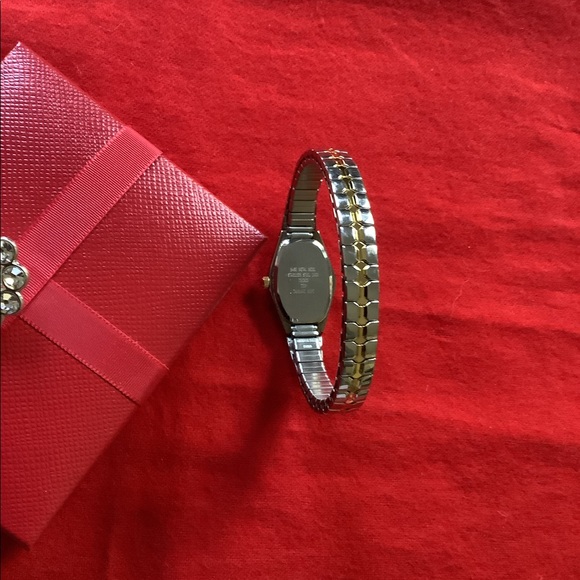 Armitron Woman’s Stretch Silver & Gold Tone Watch - Picture 3 of 6